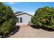 Relaxing backyard patio with seating area, surrounded by lush greenery at 2550 S Ellsworth Rd # 215, Mesa, AZ 85209