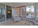 Bright sunroom with tiled floor, comfy seating, and view of backyard at 2550 S Ellsworth Rd # 215, Mesa, AZ 85209
