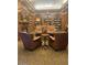 Elegant community library featuring comfortable seating and ample bookshelves at 2550 S Ellsworth Rd # 215, Mesa, AZ 85209