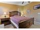 Comfortable bedroom with wooden bed frame and night stands at 2550 S Ellsworth Rd # 215, Mesa, AZ 85209
