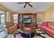 Comfortable living room featuring a media console and seating area at 2550 S Ellsworth Rd # 215, Mesa, AZ 85209