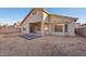 Backyard with gravel and a patio area at 12806 W Charter Oak Rd, El Mirage, AZ 85335