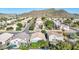 Aerial view of a residential neighborhood with a focus on a single-Gathering home at 19824 N 14 Pln, Phoenix, AZ 85024