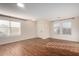 Bright and spacious living room with hardwood floors and neutral colors at 8143 E Obispo Ave, Mesa, AZ 85212