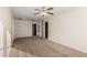 Spacious bedroom with ceiling fan and carpeting at 8143 E Obispo Ave, Mesa, AZ 85212