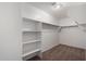 Large walk-in closet with shelving and hanging rods at 8143 E Obispo Ave, Mesa, AZ 85212