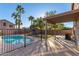 Inviting backyard pool with covered patio and fence at 8143 E Obispo Ave, Mesa, AZ 85212