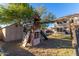 Large backyard with playset, shed, and grassy area at 8143 E Obispo Ave, Mesa, AZ 85212