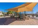 Community playground with shade sail and play equipment at 8143 E Obispo Ave, Mesa, AZ 85212