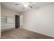 Bedroom with built-in shelving and ceiling fan at 8143 E Obispo Ave, Mesa, AZ 85212