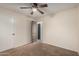 Simple bedroom with ceiling fan and carpet flooring at 8143 E Obispo Ave, Mesa, AZ 85212