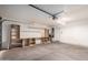 Garage with ample shelving and workbench at 8143 E Obispo Ave, Mesa, AZ 85212