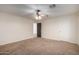 Bright bedroom with ceiling fan and carpet flooring at 8143 E Obispo Ave, Mesa, AZ 85212