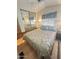 Bedroom with double bed, mirrored closet doors, and wood floor at 1541 W Yurok Ave, Apache Junction, AZ 85119