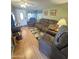 Bright living room featuring wood floors and comfy furniture at 1541 W Yurok Ave, Apache Junction, AZ 85119