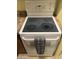 White electric range with four burners and oven at 1541 W Yurok Ave, Apache Junction, AZ 85119