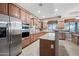 Modern kitchen with stainless steel appliances and granite counters at 6520 N 130Th Ln, Glendale, AZ 85307