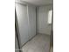 Bedroom with tile floor and sliding closet doors at 2604 W Berridge Ln # C103, Phoenix, AZ 85017