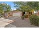 House exterior with attached two-car garage at 7818 S 74Th Ave, Laveen, AZ 85339