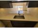 Modern kitchen sink with stone countertop at 3314 N 68Th St # 204, Scottsdale, AZ 85251