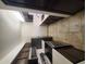 Modern kitchen with stainless steel appliances and dark wood cabinets at 3314 N 68Th St # 204, Scottsdale, AZ 85251