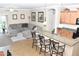 Open concept kitchen and living room with breakfast bar and comfortable sectional sofa at 901 W Witt Ave, Queen Creek, AZ 85140