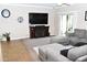 Living room with a sectional sofa, large TV, and a fireplace at 901 W Witt Ave, Queen Creek, AZ 85140
