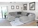 Spacious living room featuring a large sectional sofa and plenty of natural light at 901 W Witt Ave, Queen Creek, AZ 85140