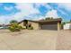 Single-story home with a two-car garage and well-maintained landscaping at 8826 E Cortez St, Scottsdale, AZ 85260