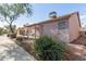 Home's rear exterior boasts a covered patio and well-maintained landscaping at 1871 E Westchester Dr, Chandler, AZ 85249