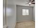 Well-lit bedroom with window and blinds at 40998 W Chambers Dr, Maricopa, AZ 85138