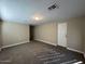 Spacious bedroom with carpet and door to exterior at 3542 E Earll Dr, Phoenix, AZ 85018