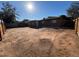 Large, open backyard with dirt ground and wooden fence at 3542 E Earll Dr, Phoenix, AZ 85018