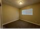 Bright bedroom with carpet flooring, window coverings, and a spacious closet at 3542 E Earll Dr, Phoenix, AZ 85018