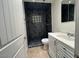 Clean bathroom with dark tile shower and vanity at 3542 E Earll Dr, Phoenix, AZ 85018