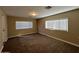 Roomy bedroom with two windows and carpet flooring at 3542 E Earll Dr, Phoenix, AZ 85018