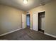 Well-lit bedroom featuring carpet, a closet, and an adjacent bathroom at 3542 E Earll Dr, Phoenix, AZ 85018