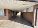 Covered carport with access to house and storage cabinets at 3542 E Earll Dr, Phoenix, AZ 85018