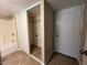 Hallway with closet and access to laundry and bathroom at 3542 E Earll Dr, Phoenix, AZ 85018