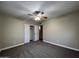 Large bedroom with ceiling fan, closet, and carpet flooring at 3542 E Earll Dr, Phoenix, AZ 85018