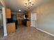 Kitchen boasts wood cabinets and granite countertops at 3542 E Earll Dr, Phoenix, AZ 85018