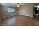 Spacious living room featuring tile flooring and neutral wall tones at 3542 E Earll Dr, Phoenix, AZ 85018