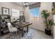 Dedicated home office with a large desk and ample natural light at 9243 E Sector Dr, Mesa, AZ 85212