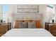 Main bedroom featuring a bed with a tufted headboard and layered pillows at 9243 E Sector Dr, Mesa, AZ 85212
