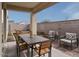 Relaxing backyard patio with seating area and fire pit at 9243 E Sector Dr, Mesa, AZ 85212