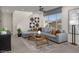 Spacious living room featuring a large sectional sofa and a wood coffee table at 9243 E Sector Dr, Mesa, AZ 85212