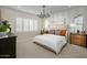 Spacious main bedroom with a plush bed and stylish nightstands at 9243 E Sector Dr, Mesa, AZ 85212