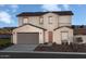 Two-story house with beige walls and terracotta roof at 9243 E Sector Dr, Mesa, AZ 85212