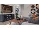 Living room with sectional sofa, large TV, and stylish wall art at 9243 E Sector Dr, Mesa, AZ 85212