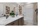 Clean bathroom with double sinks, a tub, and a shower at 9243 E Sector Dr, Mesa, AZ 85212